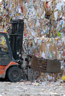 Image of cardboard for recycling being moved with a forklift
